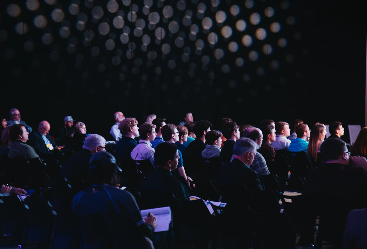 Large audience seated at a public address event