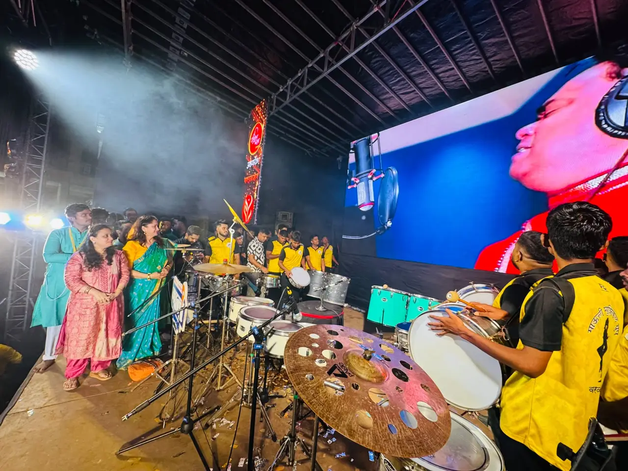 Dancers performing on a lit stage at a KaivalyaVaari programme
